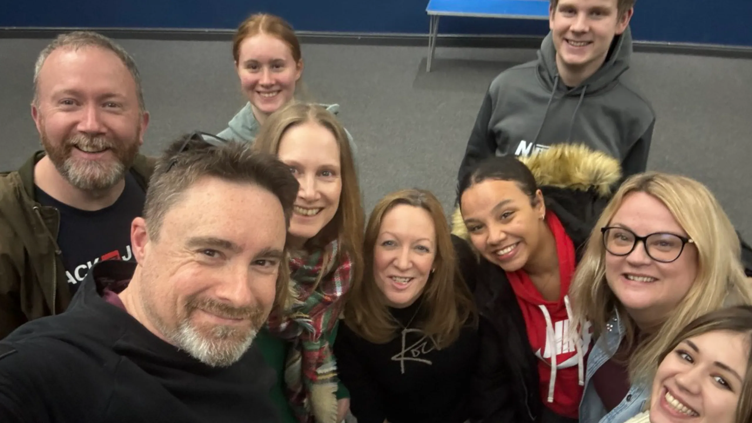 A group of Crowd Church members smiling together